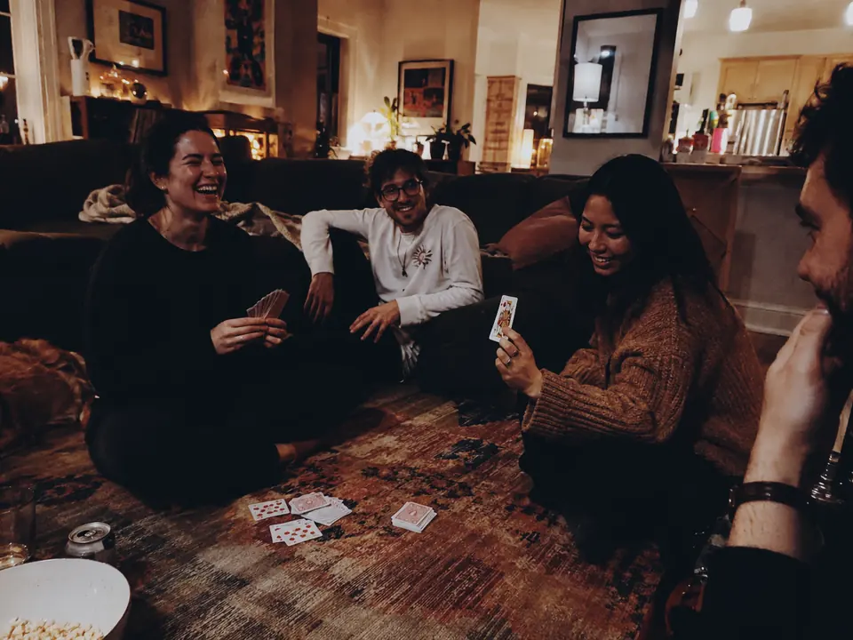 Friends enjoying a quiet evening of cards together